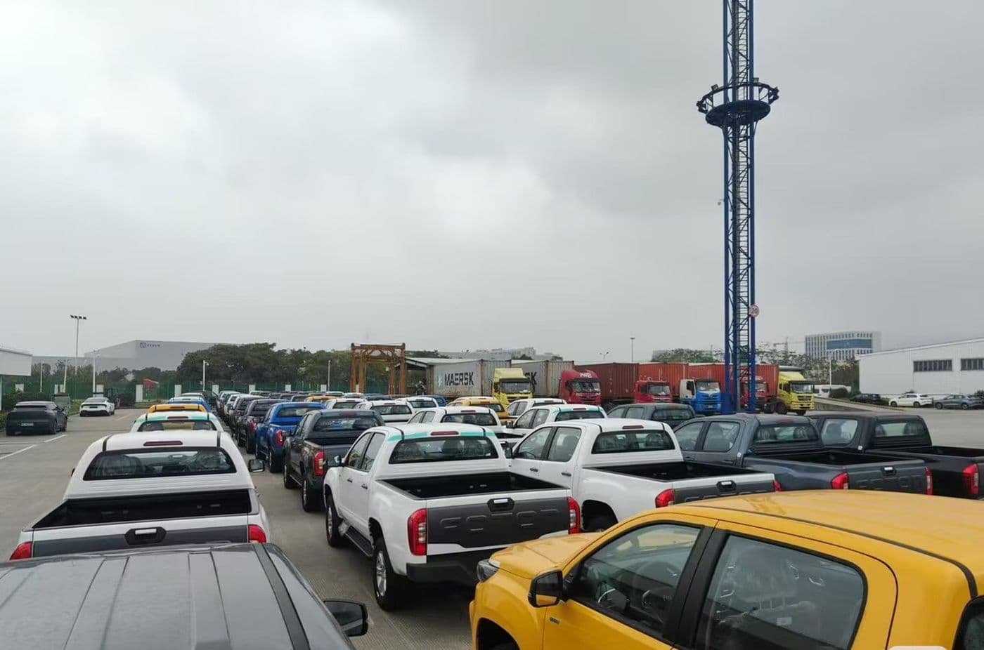 Pickup trucks and SUVs staged at a Chinese export port before shipping
